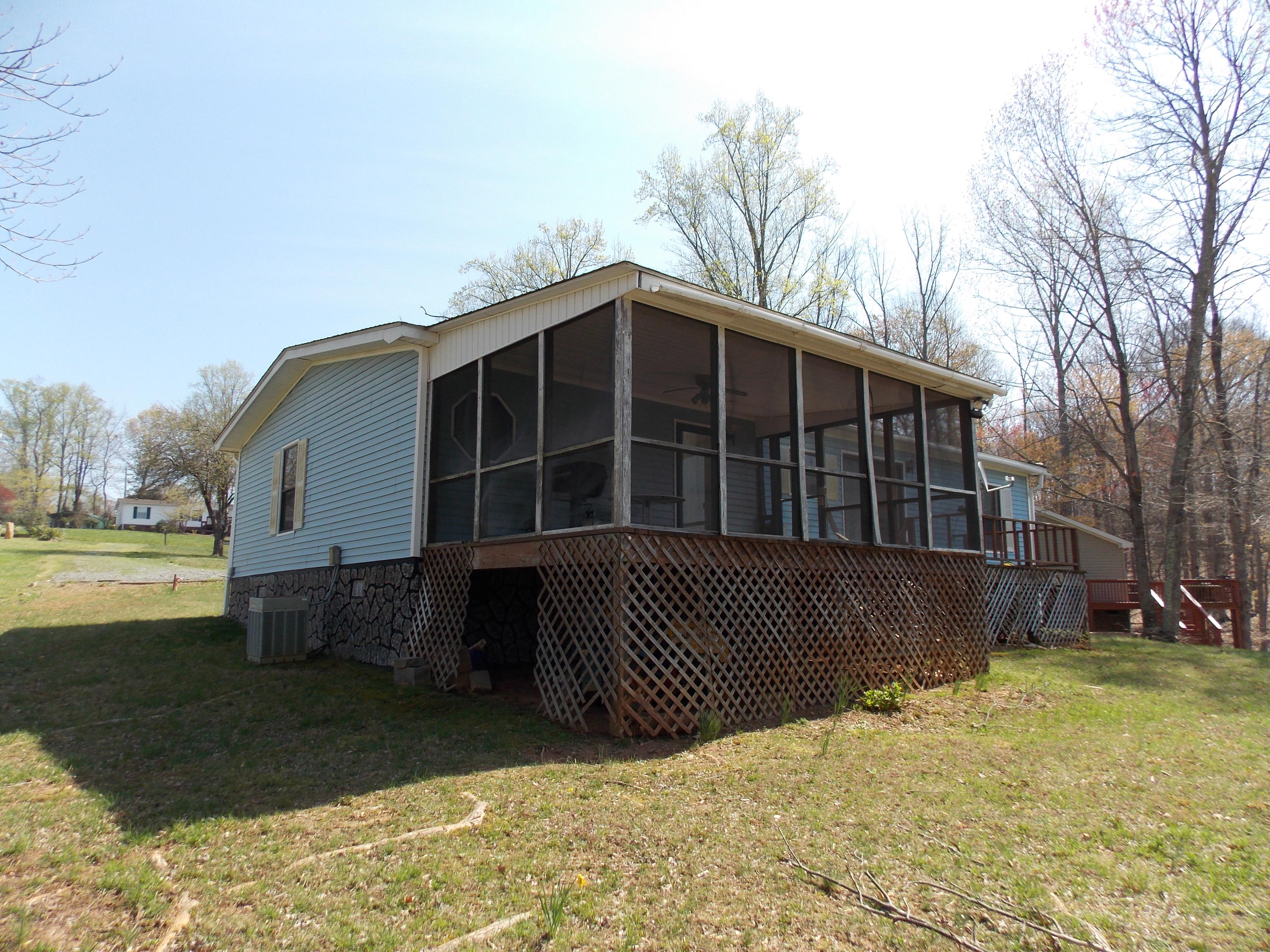 356 Cool Branch Road Penhook, VA 24137 - Photo 7 of 40 a front view of a house with a yard