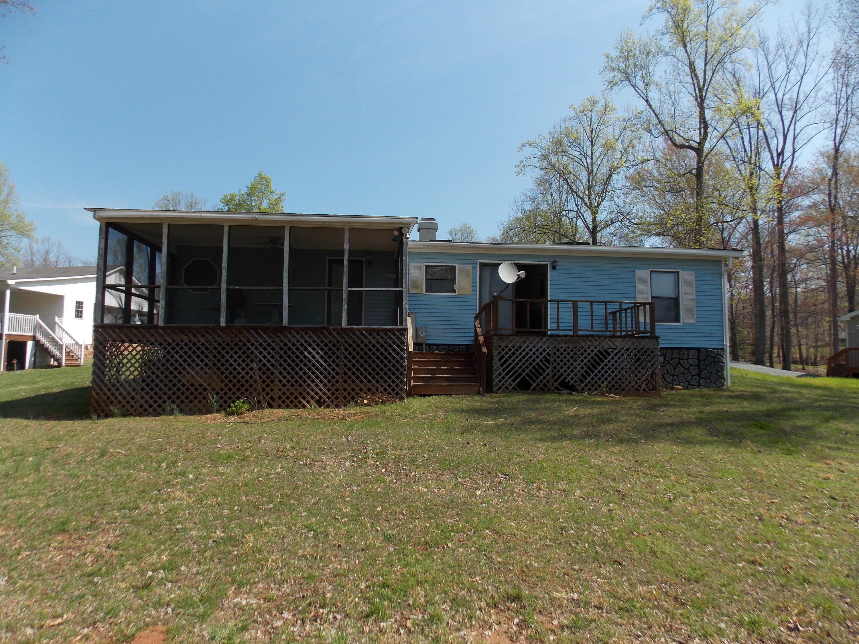 356 Cool Branch Road Penhook, VA 24137 - Photo 8 of 40 a view of a house with a yard