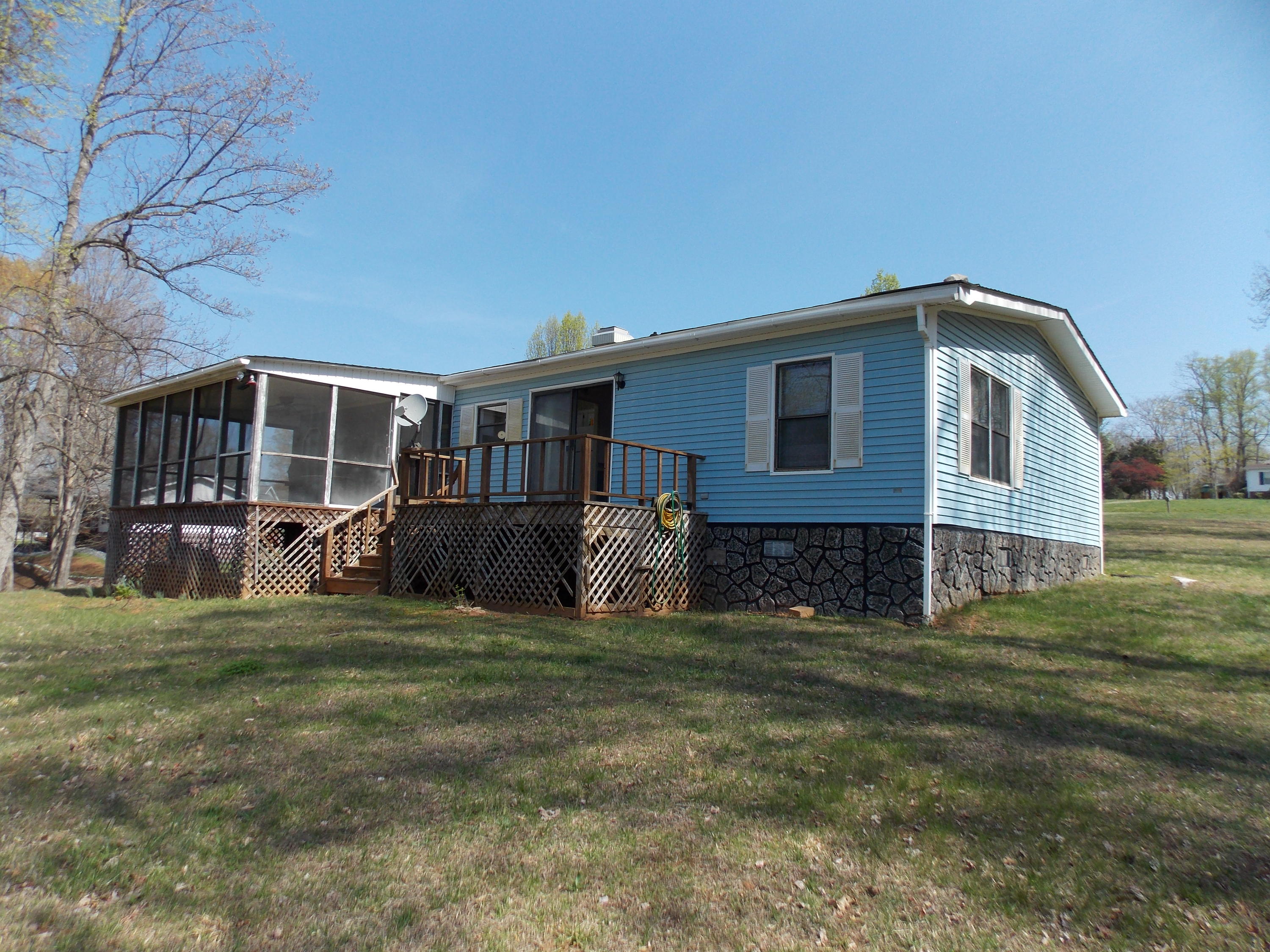 356 Cool Branch Road Penhook, VA 24137 - Photo 9 of 40 a view of a house with a yard