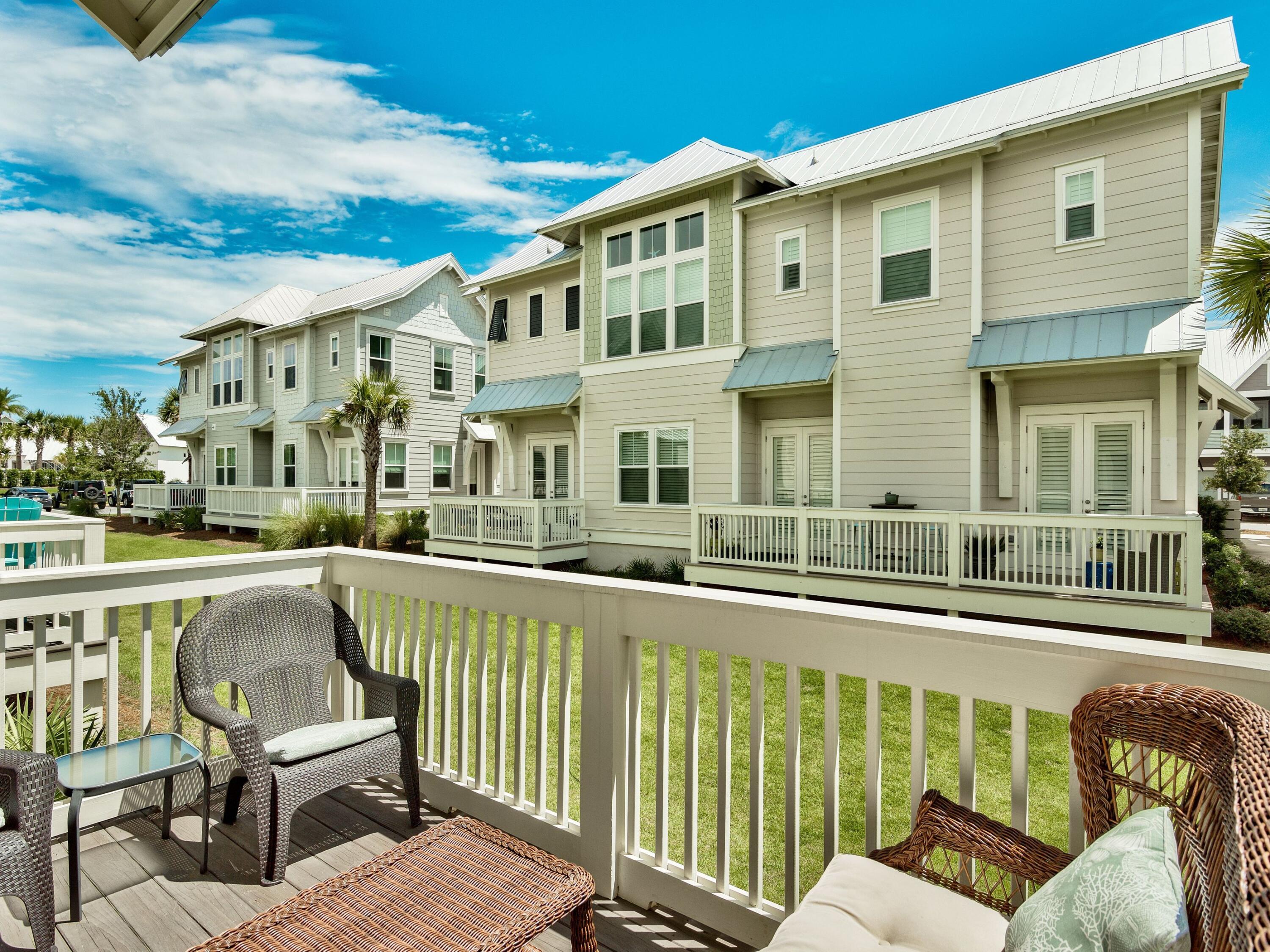 25 York Ln Inlet Beach, Unit B Inlet Beach, FL 32461 - Photo 11 of 14 a balcony with table and chairs