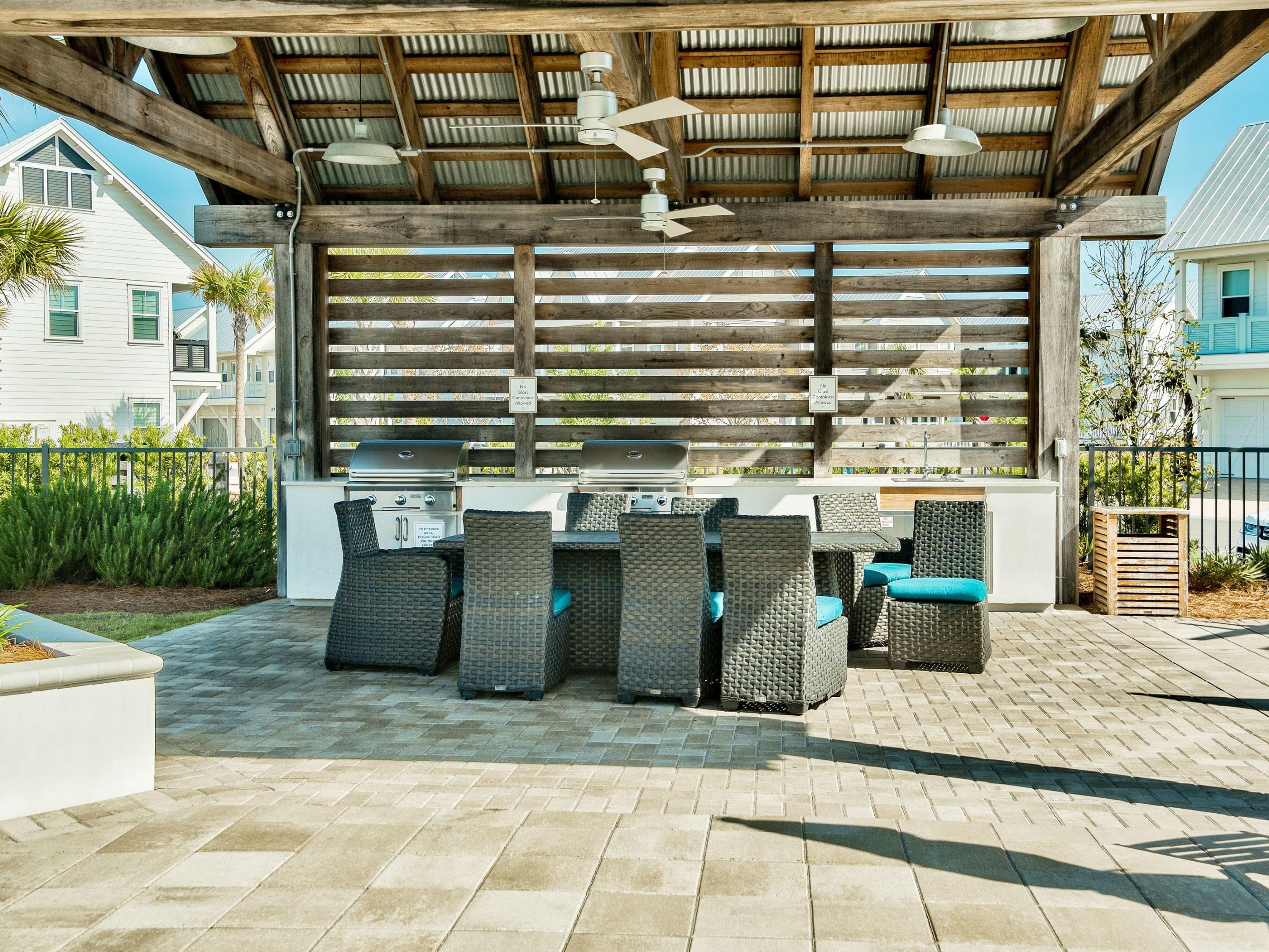25 York Ln Inlet Beach, Unit B Inlet Beach, FL 32461 - Photo 14 of 14 a view of dinning table and chairs in patio