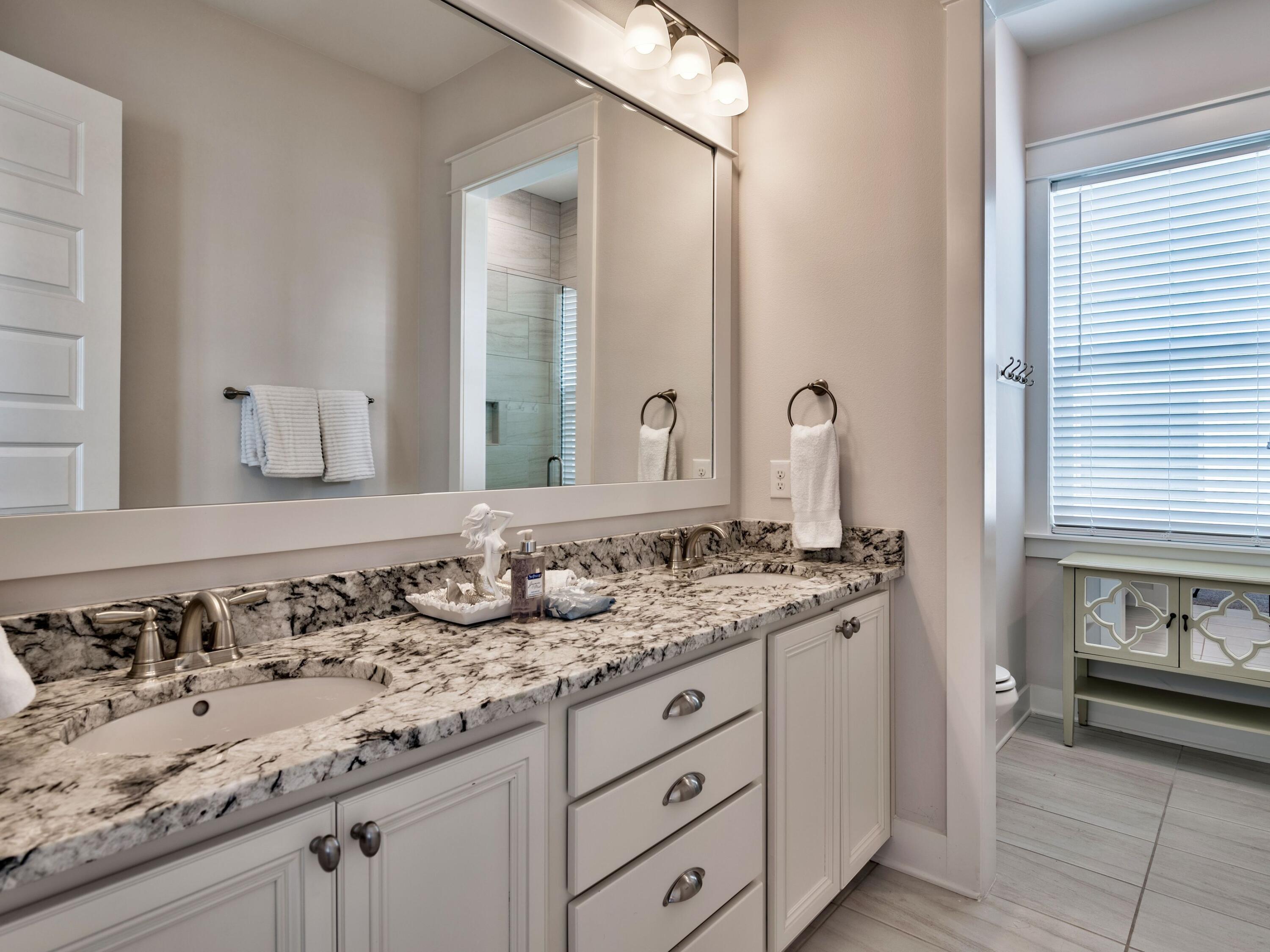 25 York Ln Inlet Beach, Unit B Inlet Beach, FL 32461 - Photo 7 of 14 a bathroom with a sink and a mirror