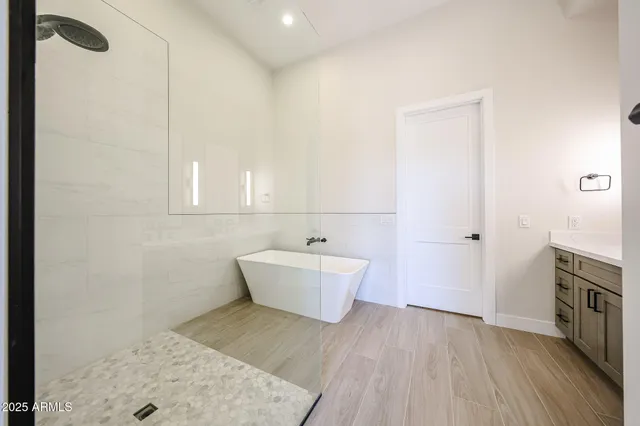 a bathroom with a sink a mirror and a bathtub