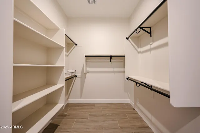 a view of an empty walk in closet