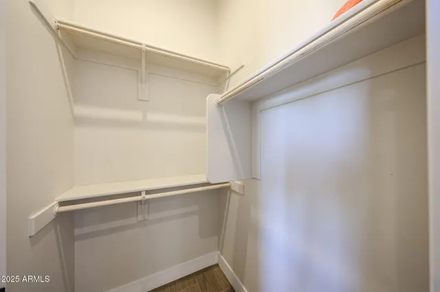 a view of an empty walk in closet