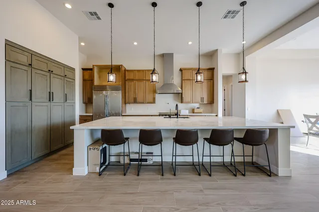 a kitchen with a table and chairs