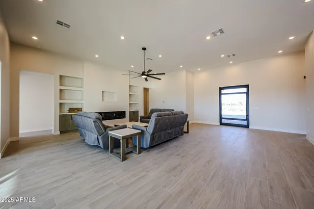a living room with furniture window and wooden floor