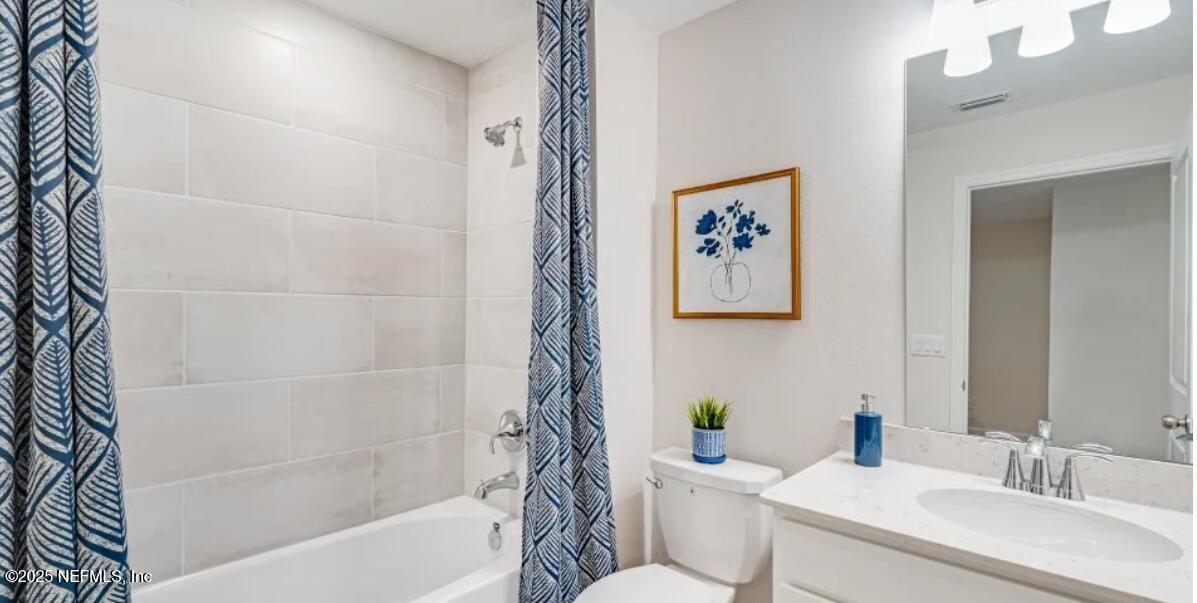 150 Hubbard Bend St. Augustine, FL 32092 - Photo 24 of 37 a bathroom with a sink a toilet and a bathtub