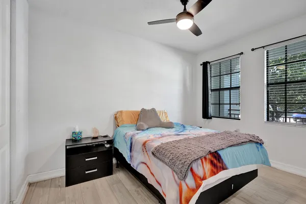 a bedroom with a bed and window
