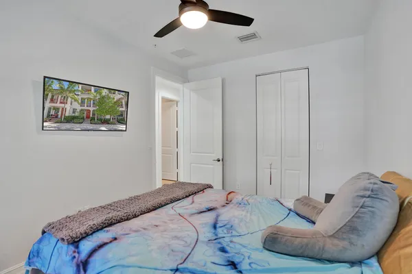 a bedroom with bed and a couch