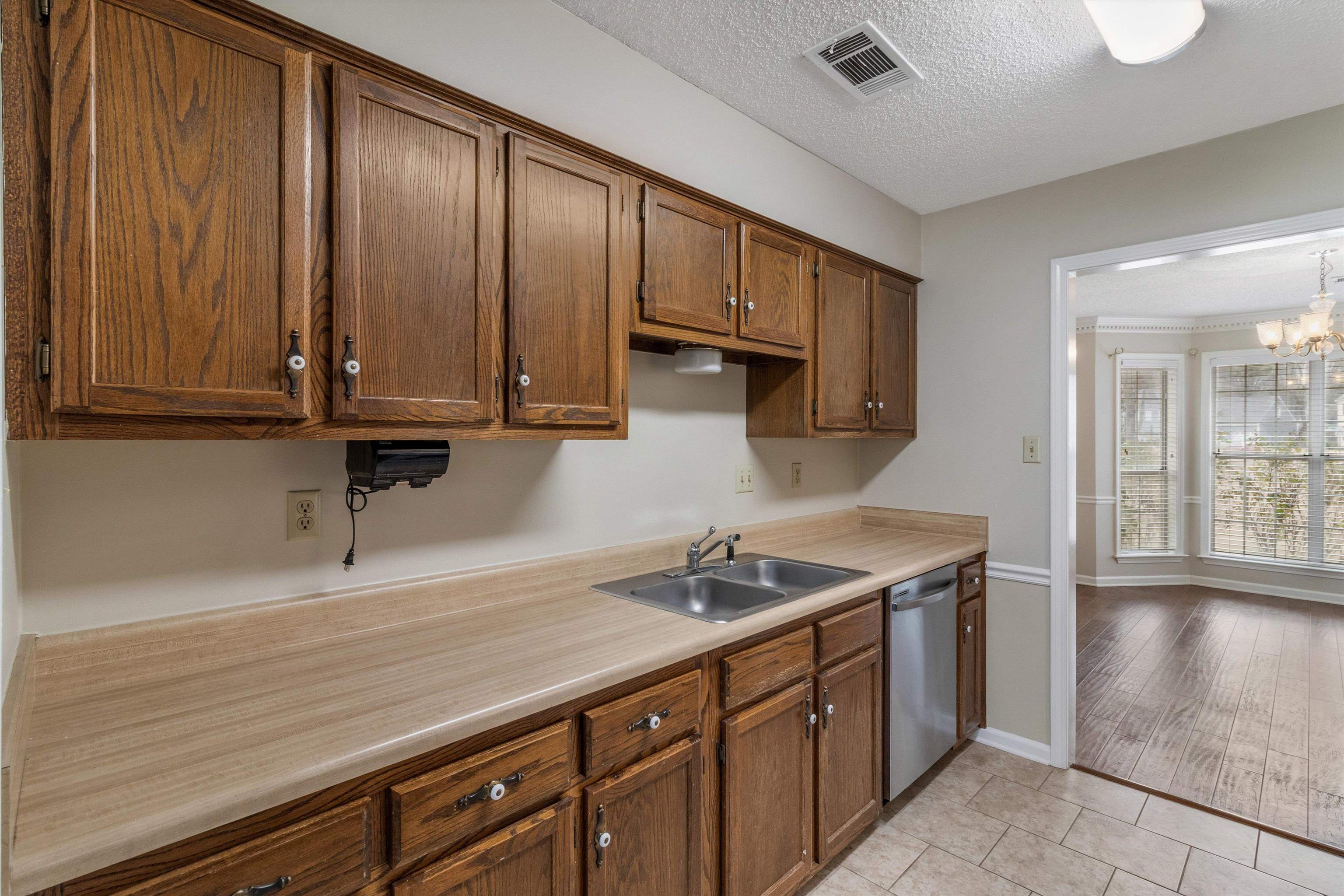 486 Harts Way Drive Collierville, TN 38017 - Photo 15 of 39 a kitchen with stainless steel appliances granite countertop a sink a stove and cabinets