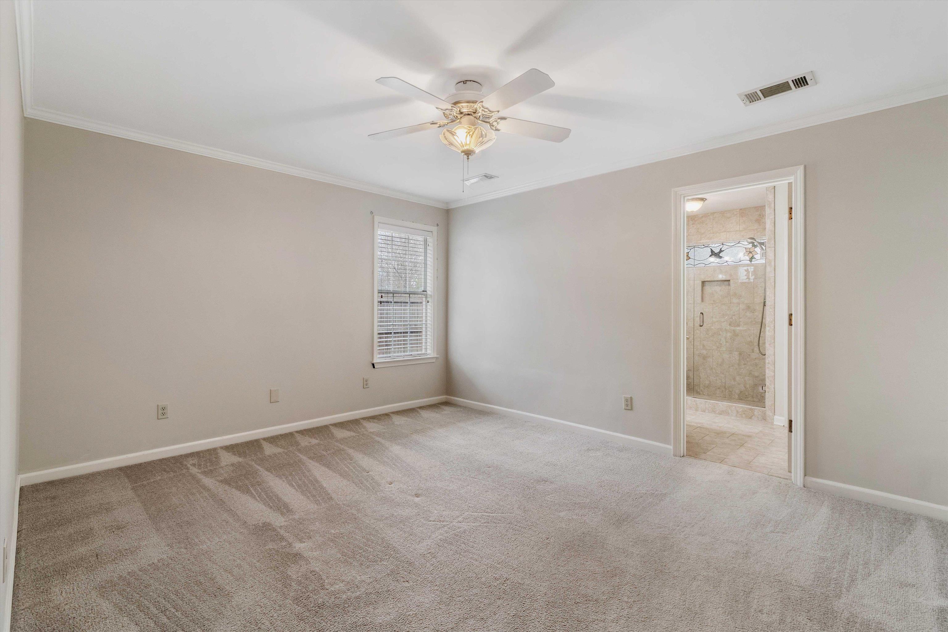 486 Harts Way Drive Collierville, TN 38017 - Photo 17 of 39 wooden floor in an empty room with a window