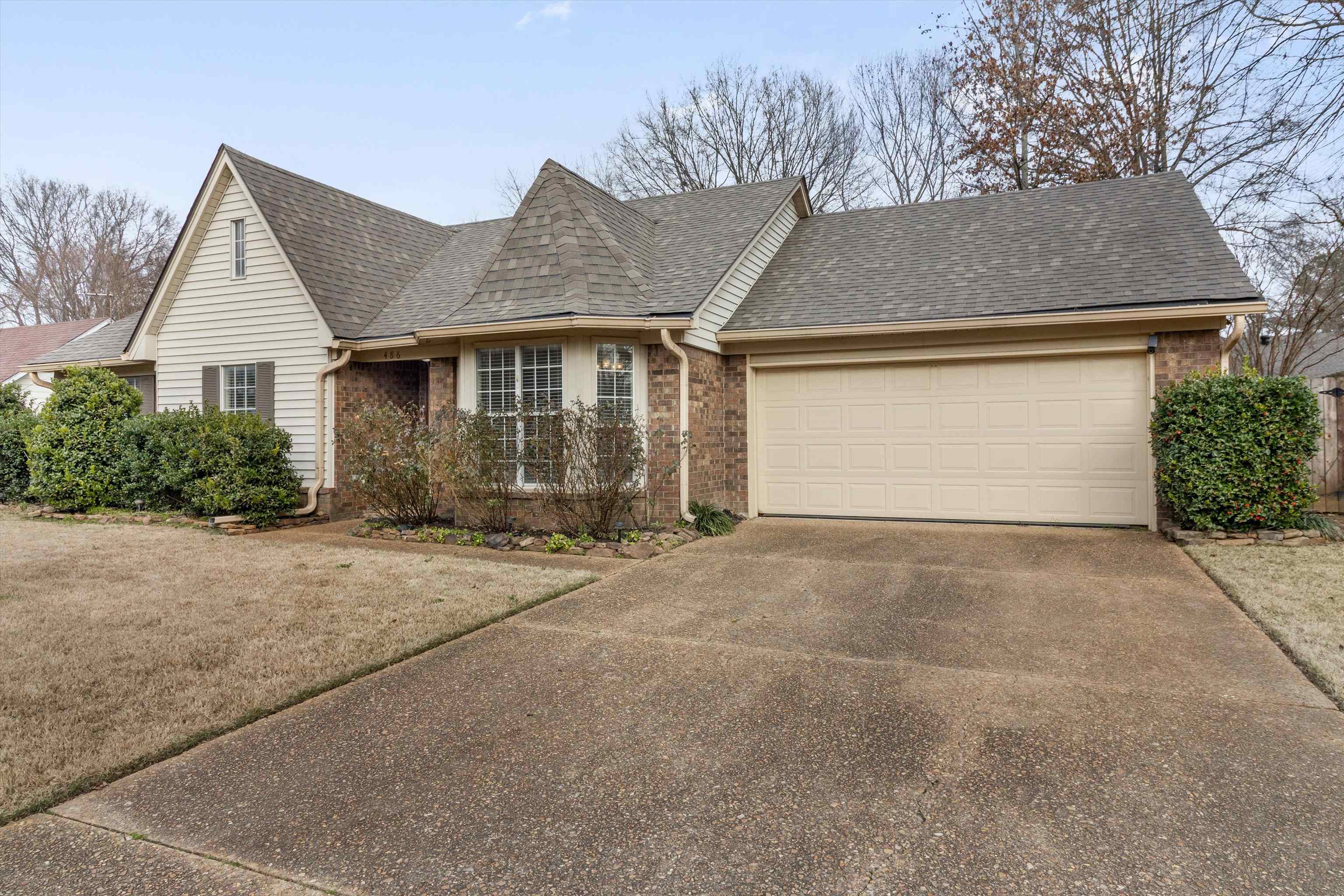 486 Harts Way Drive Collierville, TN 38017 - Photo 2 of 39 a front view of house with garage and yard