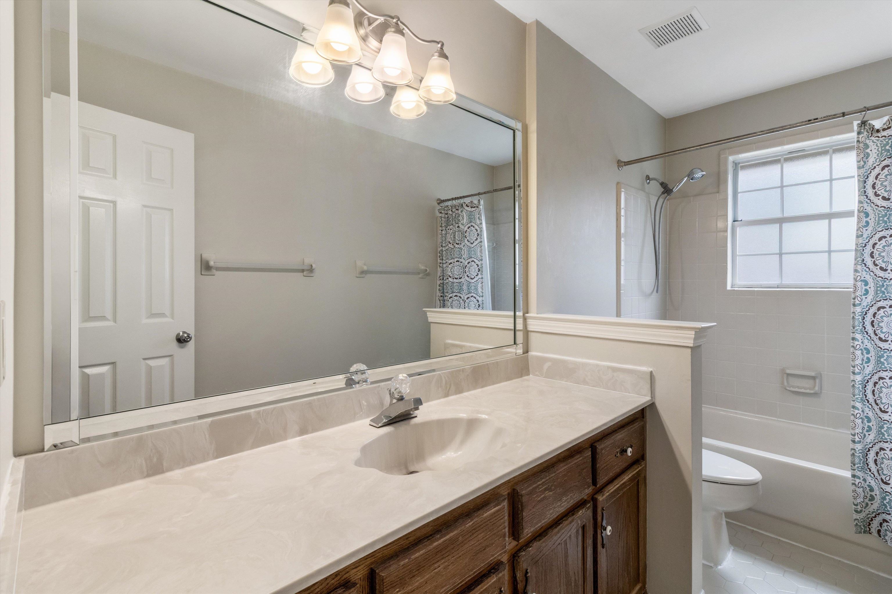 486 Harts Way Drive Collierville, TN 38017 - Photo 23 of 39 a bathroom with a sink and a mirror