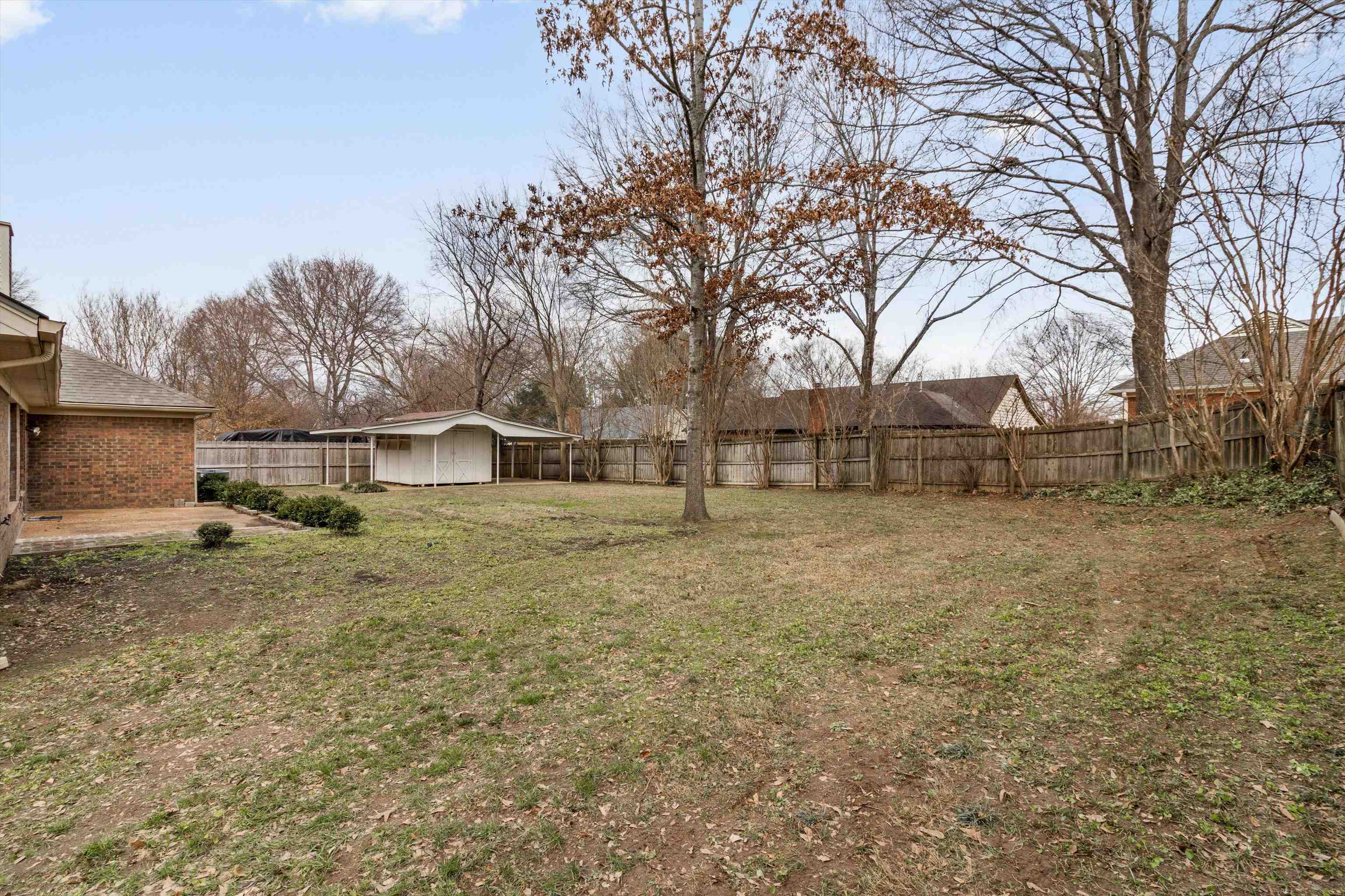 486 Harts Way Drive Collierville, TN 38017 - Photo 26 of 39 a view of a yard with wooden fence