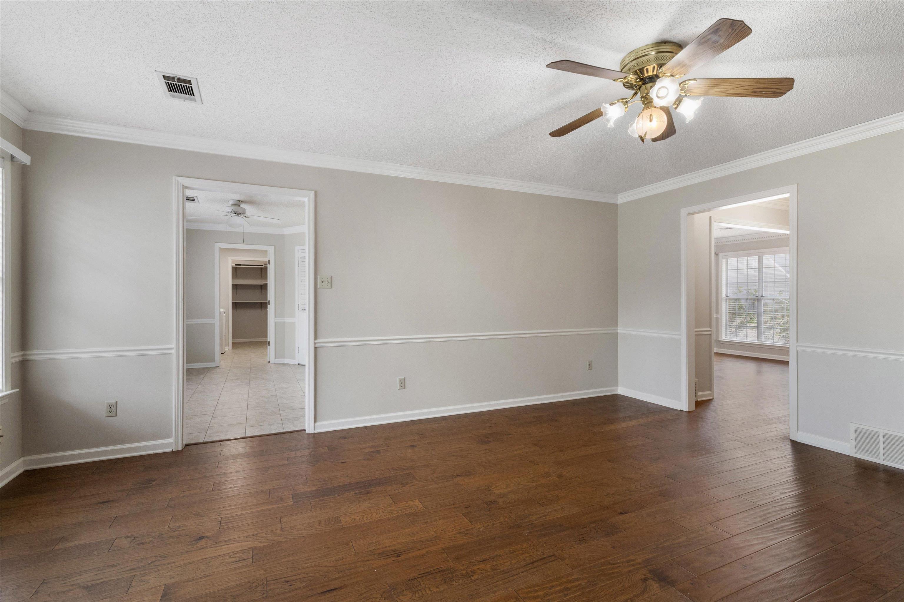 486 Harts Way Drive Collierville, TN 38017 - Photo 9 of 39 wooden floor in an empty room with a window
