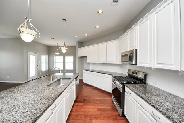 a living room with furniture fireplace and window