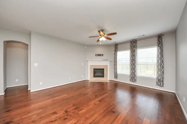 a view of a kitchen with a stove and a ceiling fan