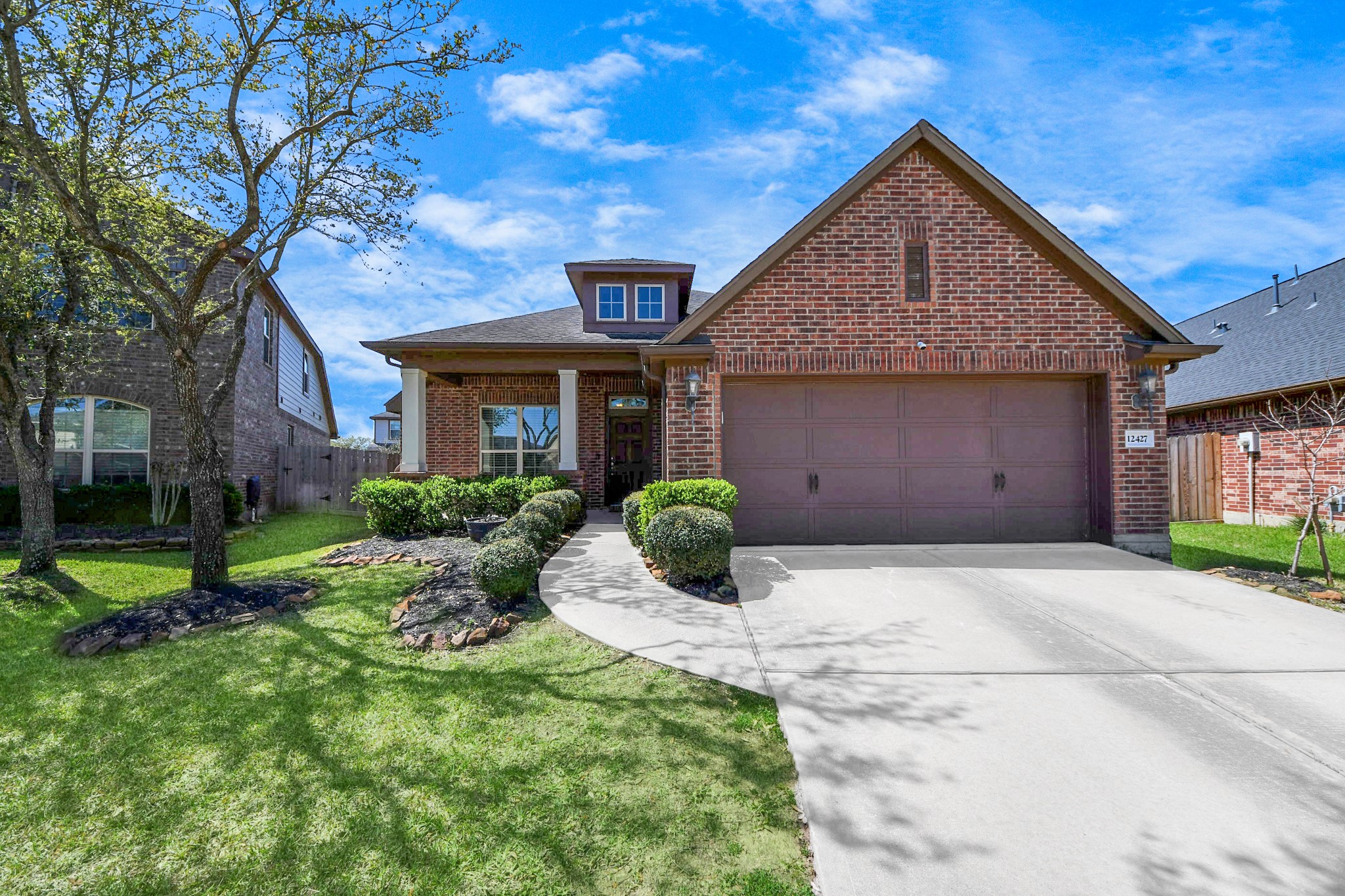12427 Point Arbor Court Tomball, TX 77377 - Photo 3 of 50 a front view of a house with a yard and garage