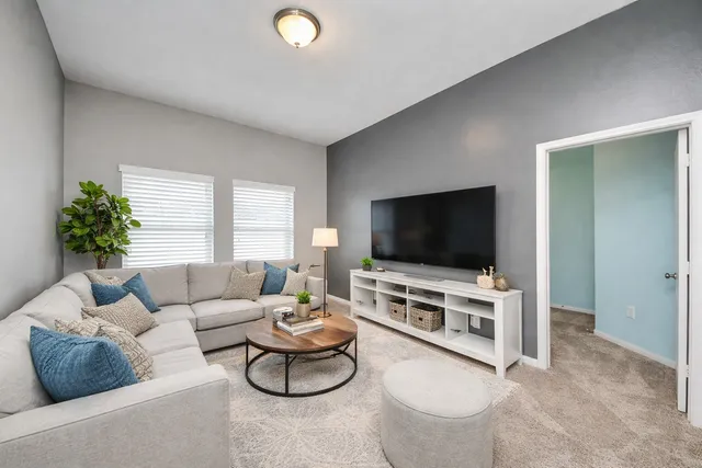 a view of a livingroom with a furniture