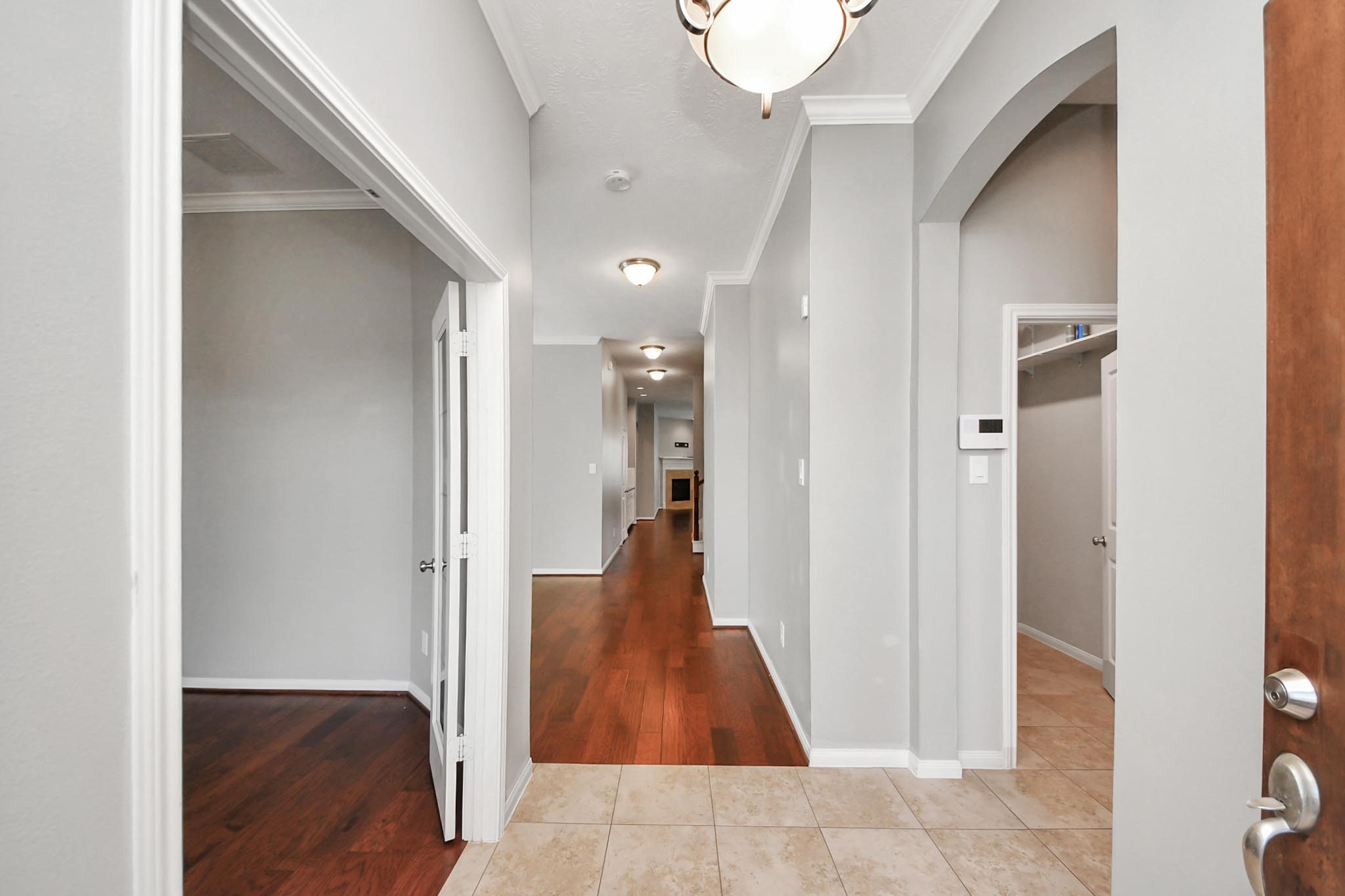 12427 Point Arbor Court Tomball, TX 77377 - Photo 8 of 50 a view of a hallway with wooden floor and staircase