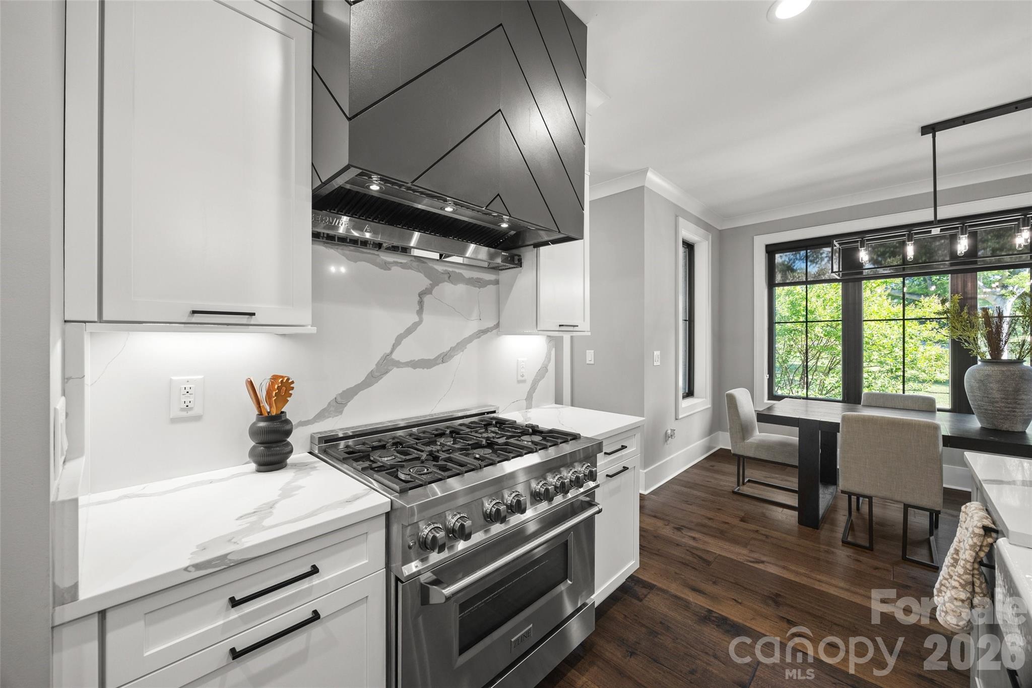 5438 Ralph Harper Lane Clover, SC 29710 - Photo 13 of 28 a kitchen with a stove a window cabinets and stainless steel appliances