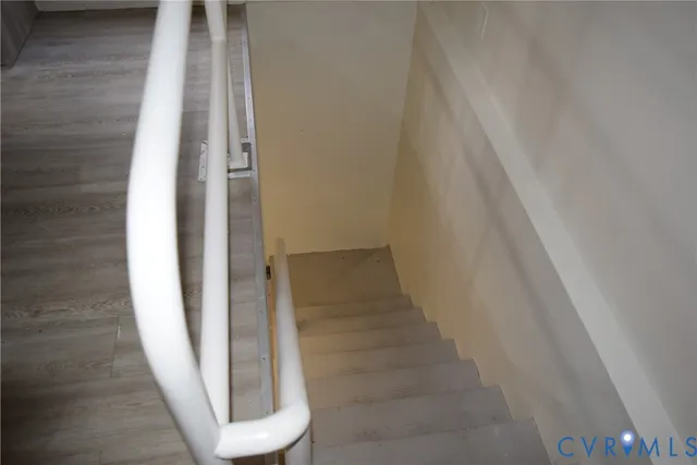 a couple of cars parked in front of brick building