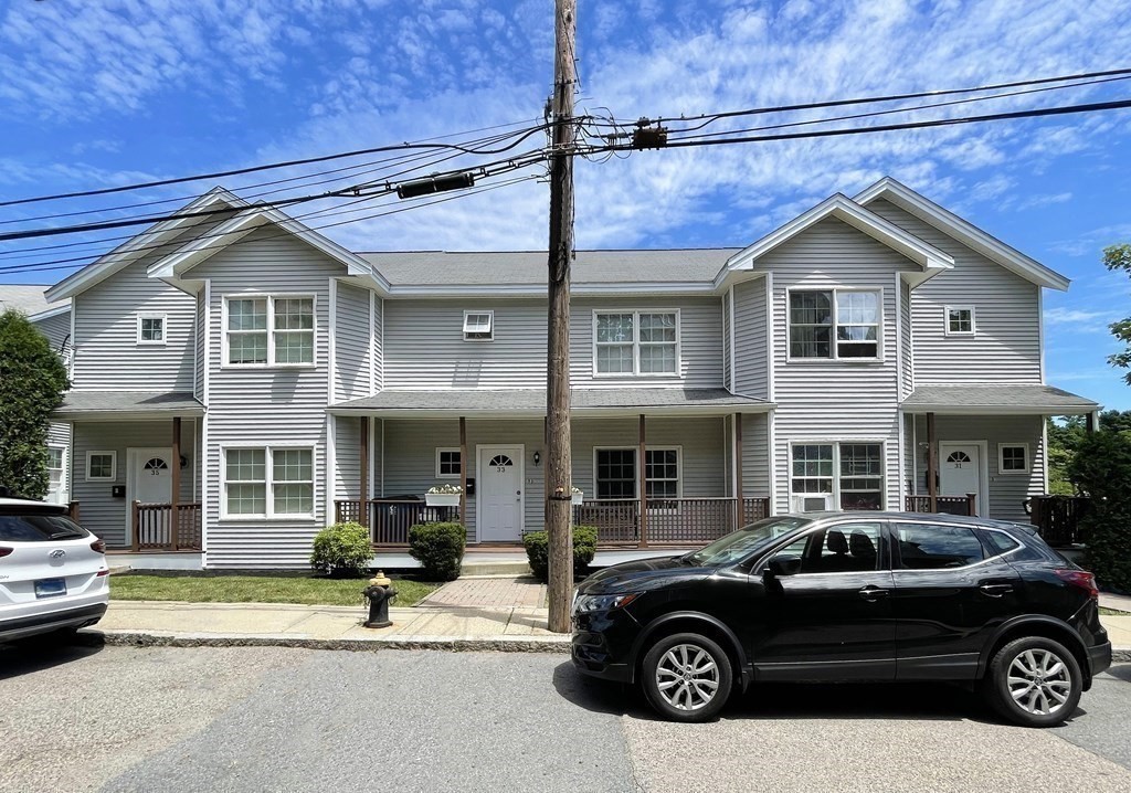 31-35 Juniper Street Boston, MA 02119 - Photo 1 of 14 a car parked in front of a house