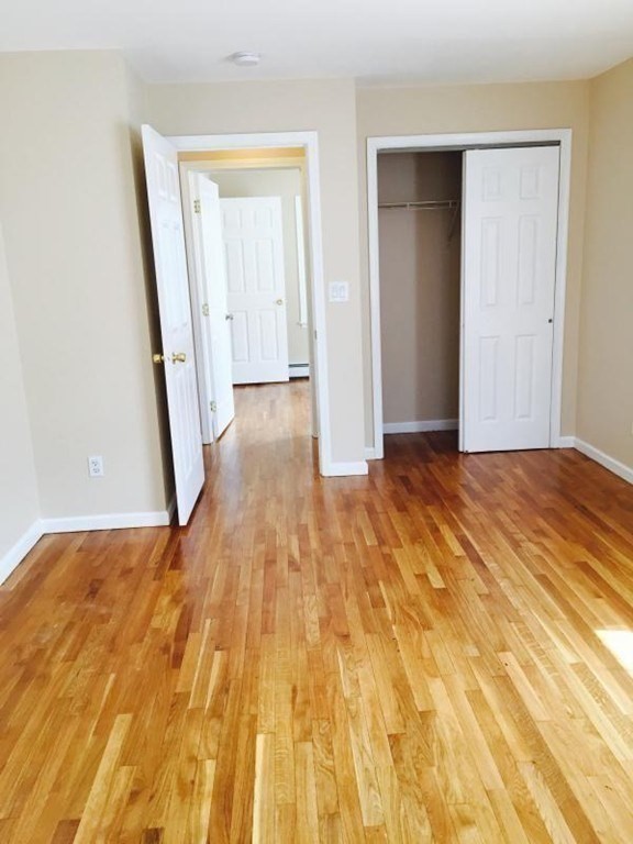 31-35 Juniper Street Boston, MA 02119 - Photo 9 of 14 a view of a room with wooden floor and staircase