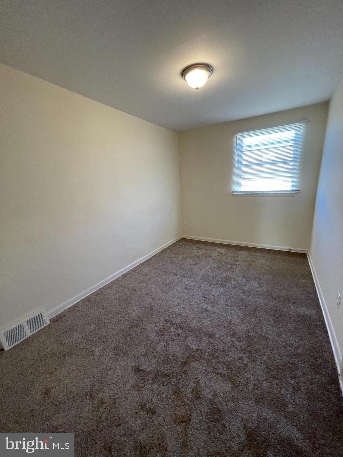 3937 Ellington Road, Unit 2 Philadelphia, PA 19131 - Photo 6 of 17 an empty room with a empty space and windows