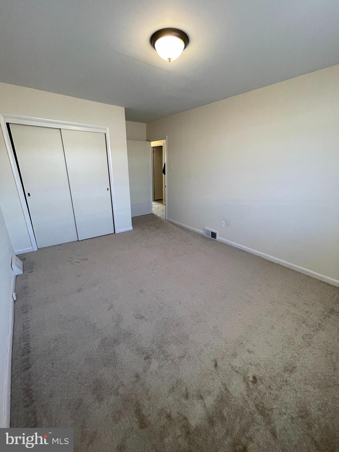 3937 Ellington Road, Unit 2 Philadelphia, PA 19131 - Photo 9 of 17 an empty room with a natural light