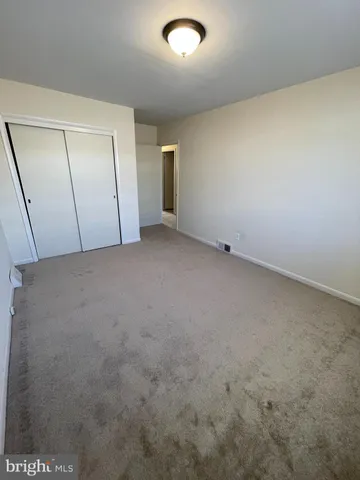 an empty room with a bench