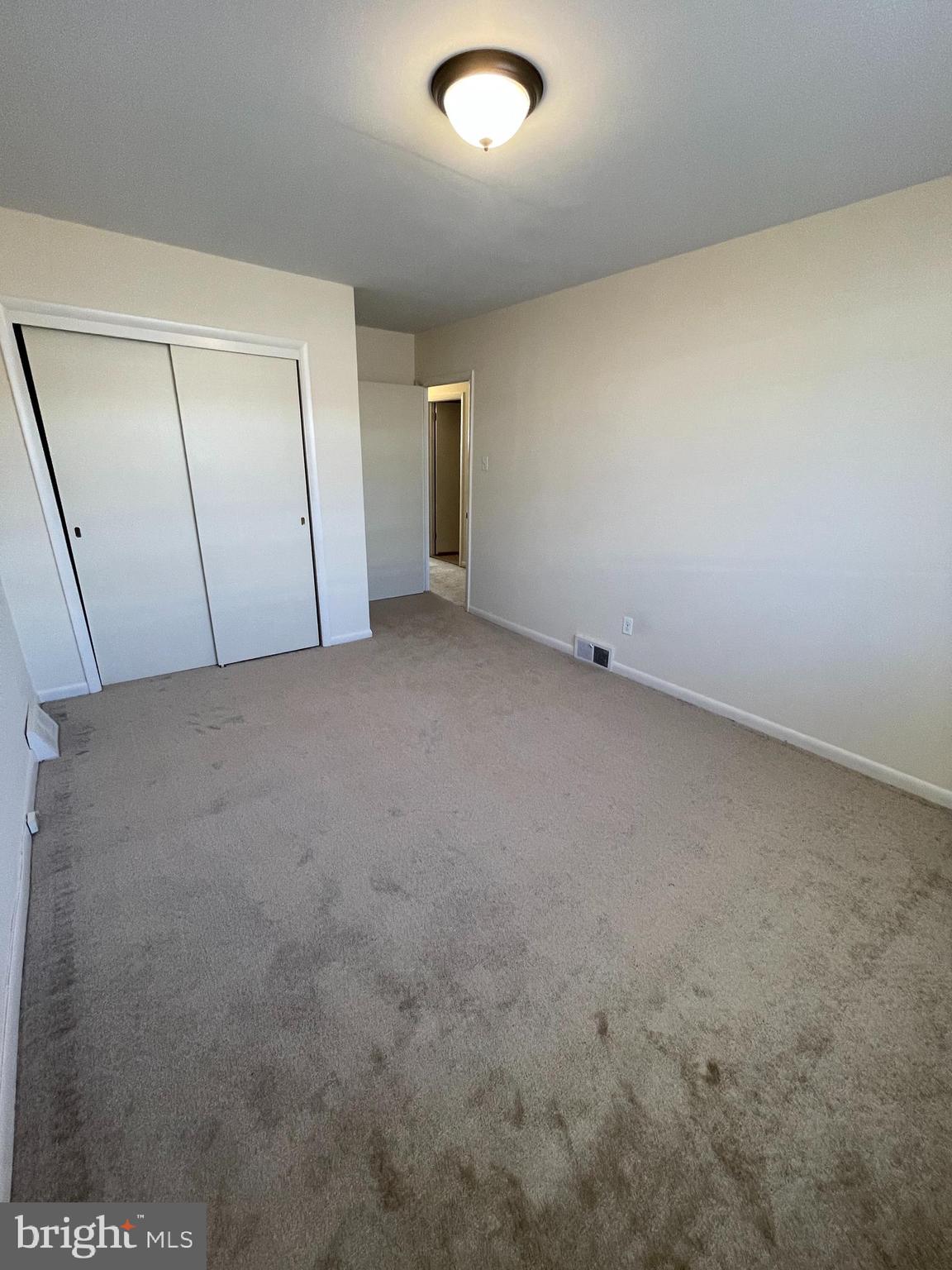 3937 Ellington Road, Unit 2 Philadelphia, PA 19131 - Photo 10 of 17 an empty room with a bench