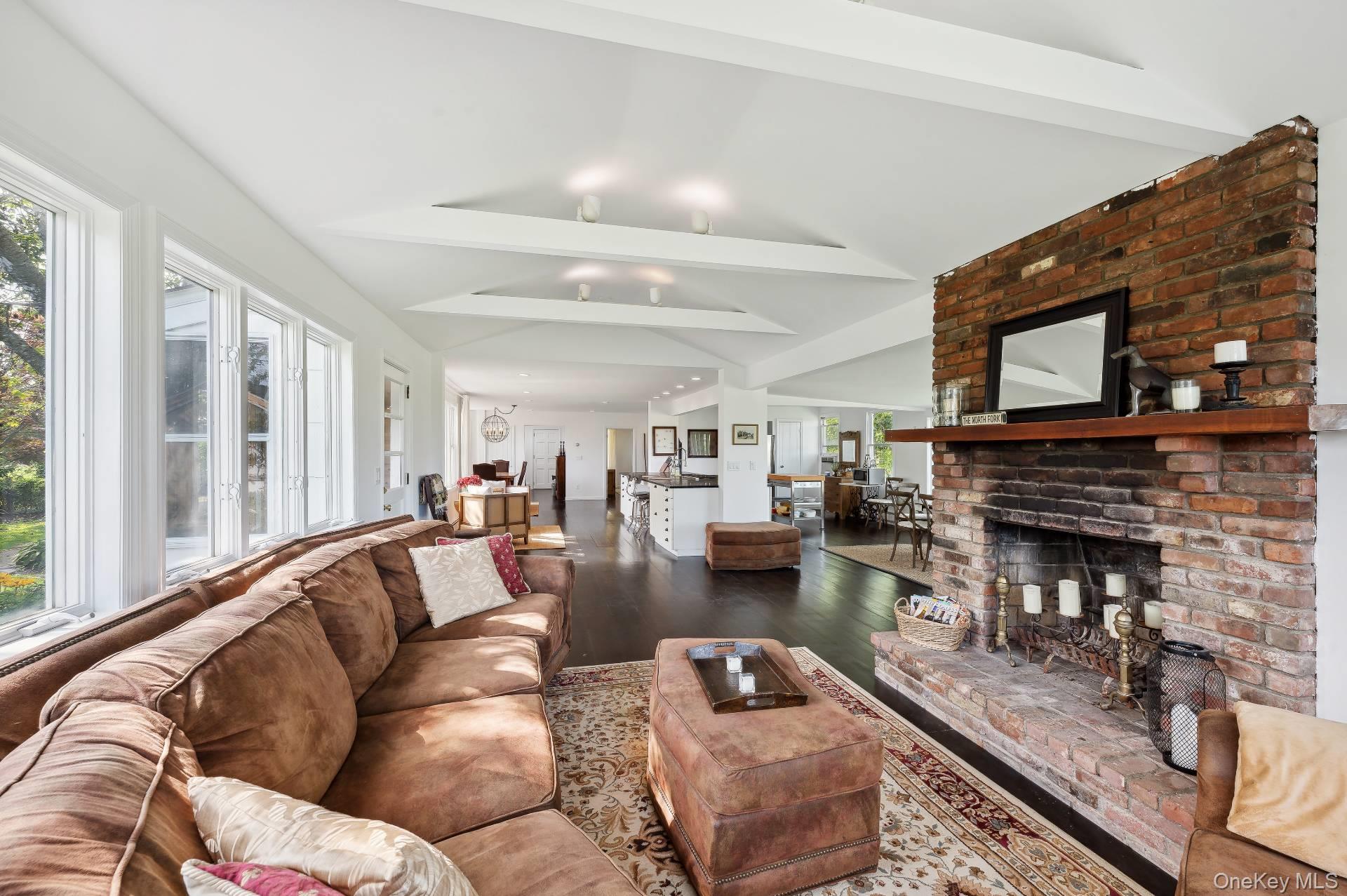 2600 Oregon Road Mattituck, NY 11952 - Photo 14 of 30 a living room with furniture and a fireplace