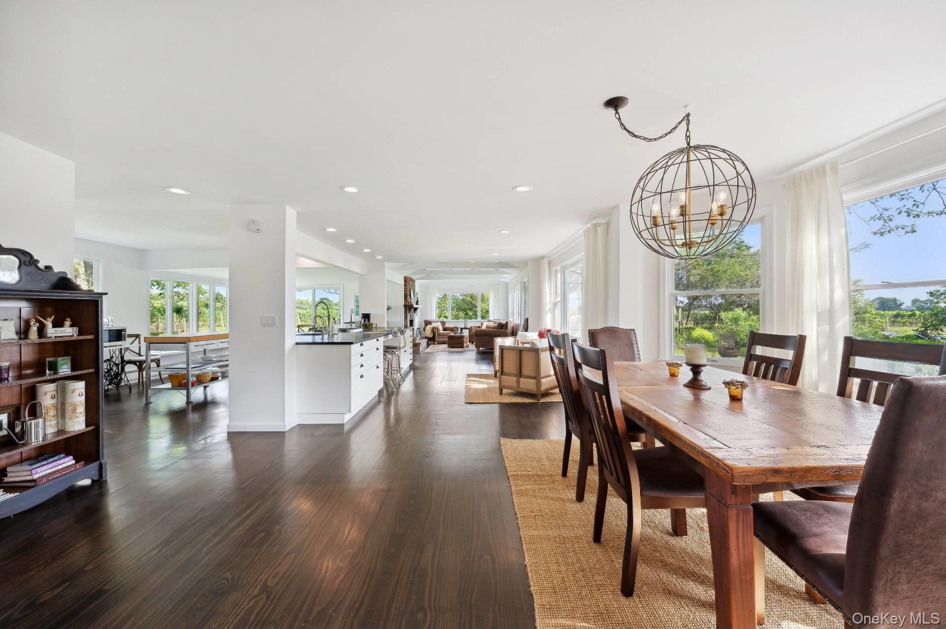 2600 Oregon Road Mattituck, NY 11952 - Photo 20 of 30 a view of a dining room with furniture window and wooden floor