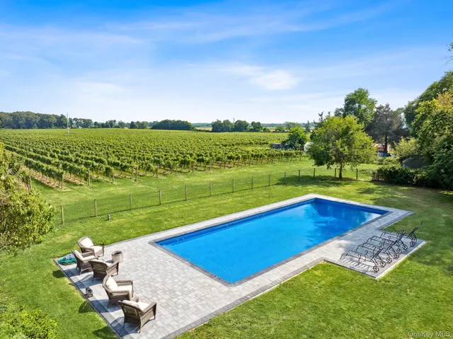 a view of a swimming pool and a yard