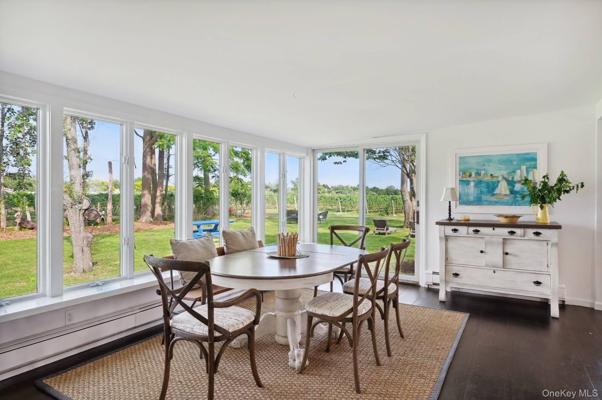 2600 Oregon Road Mattituck, NY 11952 - Photo 23 of 30 a view of a dining room with furniture window and outside view