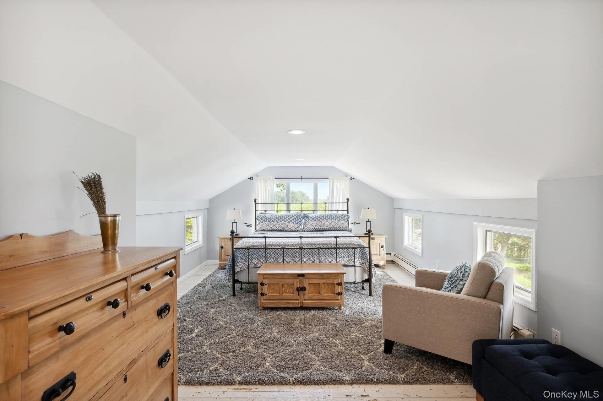 2600 Oregon Road Mattituck, NY 11952 - Photo 25 of 30 a living room with furniture and a fireplace