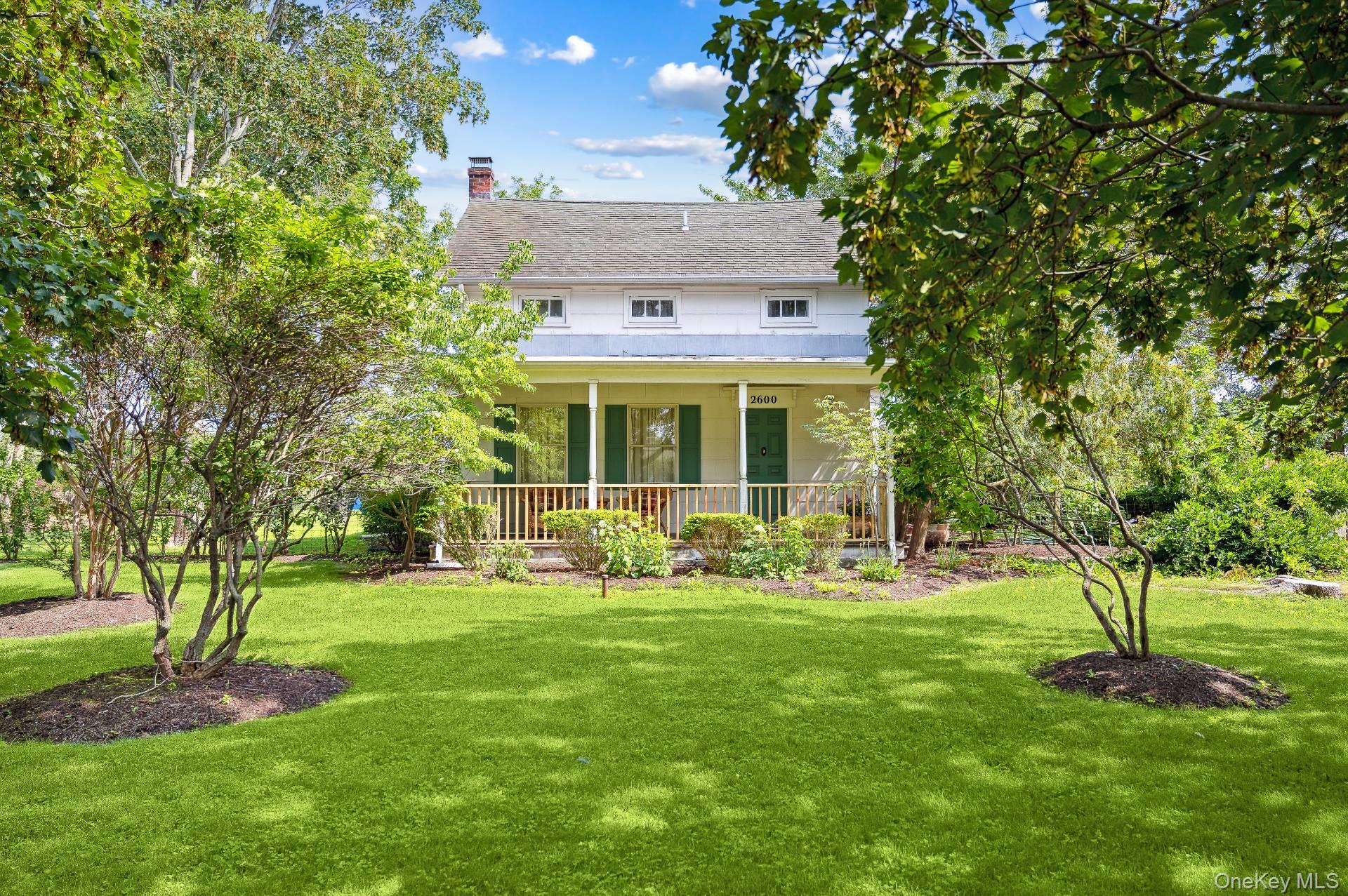 2600 Oregon Road Mattituck, NY 11952 - Photo 7 of 30 a front view of a house with a yard