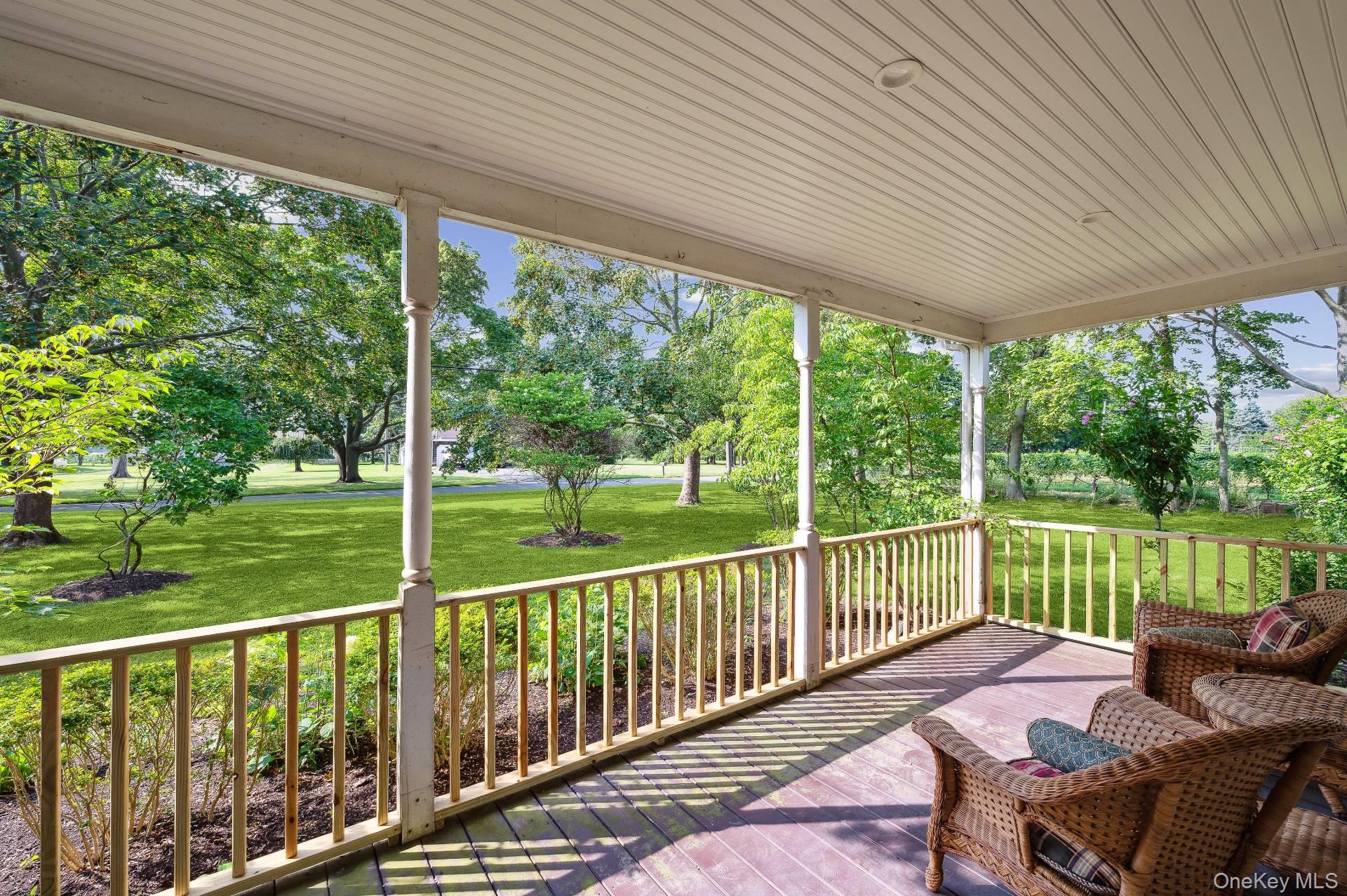 2600 Oregon Road Mattituck, NY 11952 - Photo 9 of 30 a balcony with furniture and garden