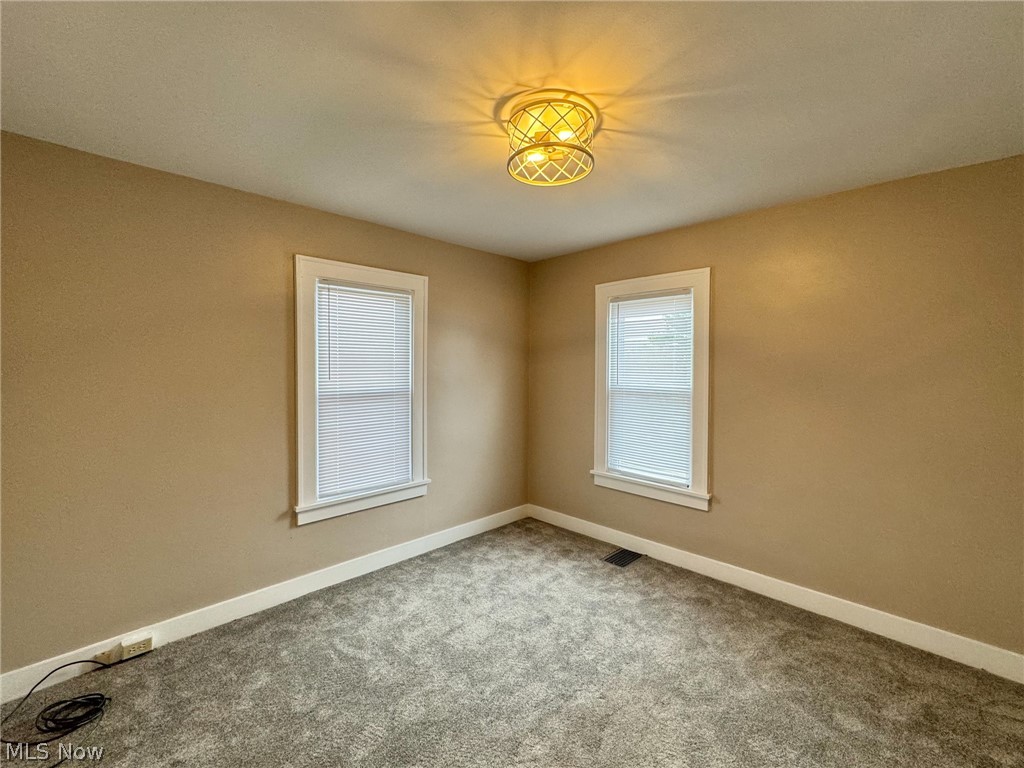 507 Canton Road Wintersville, OH 43953 - Photo 21 of 45 Spare room featuring carpet