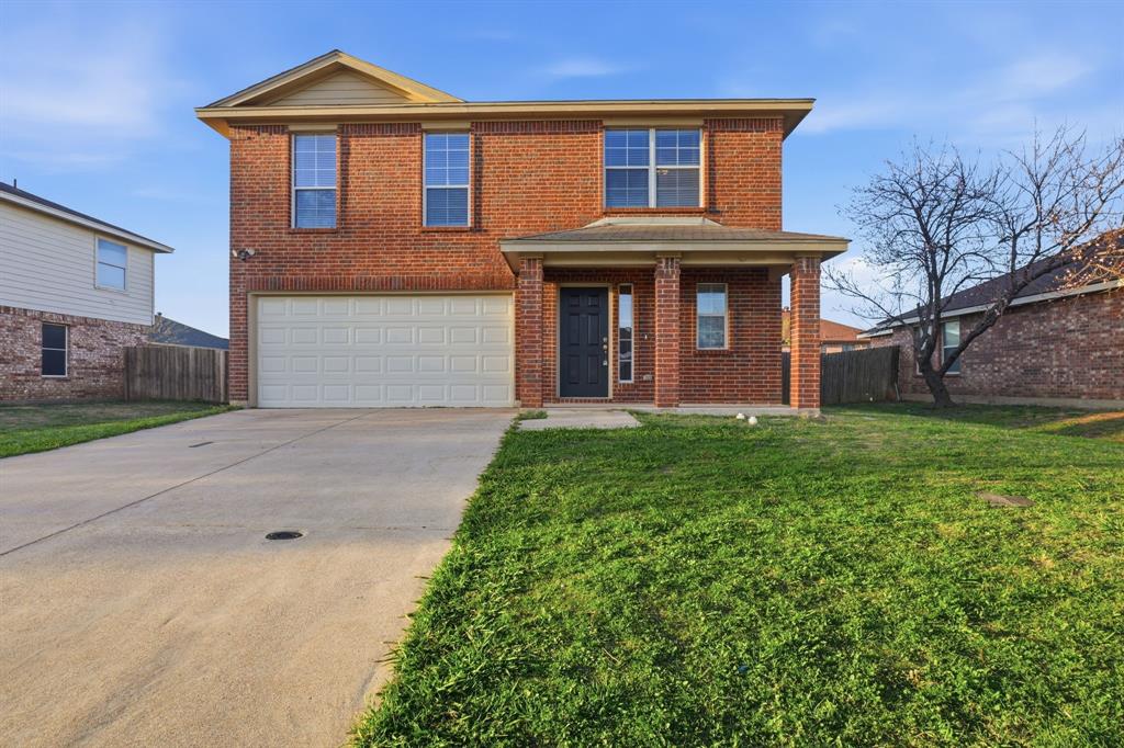 111 Maned Drive Sanger, TX 76266 - Photo 1 of 40 a front view of a house with garden