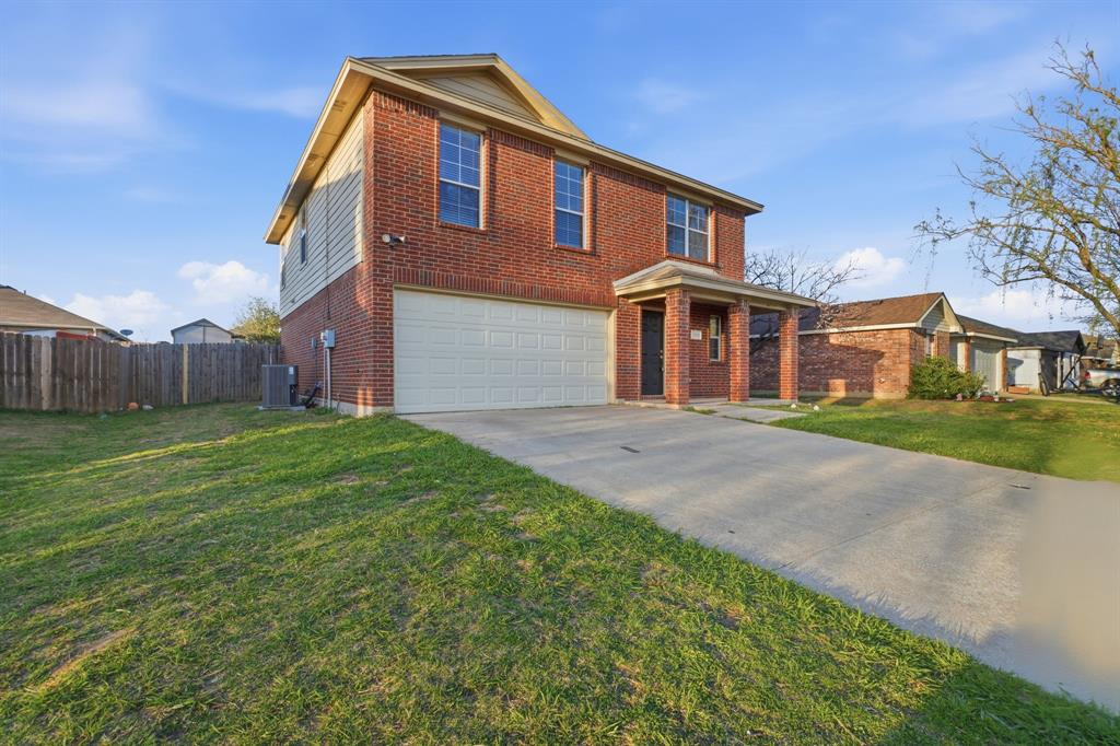 111 Maned Drive Sanger, TX 76266 - Photo 2 of 40 a front view of a house with garden