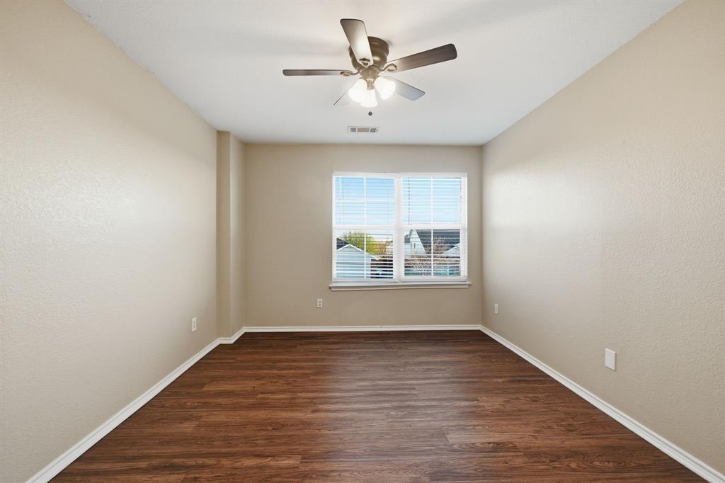 111 Maned Drive Sanger, TX 76266 - Photo 22 of 40 wooden floor in an empty room with a window