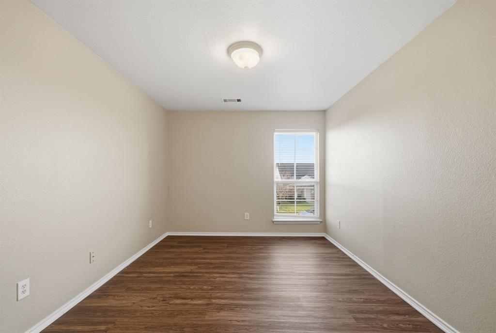 111 Maned Drive Sanger, TX 76266 - Photo 26 of 40 wooden floor in an empty room with a window