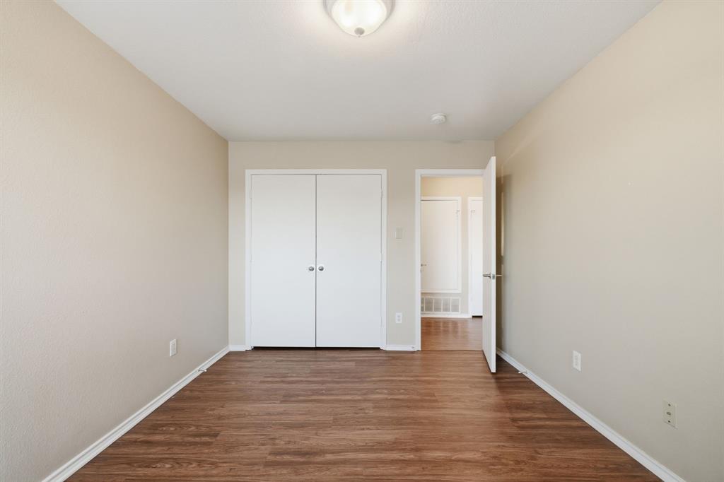 111 Maned Drive Sanger, TX 76266 - Photo 27 of 40 a view of an empty room with wooden floor