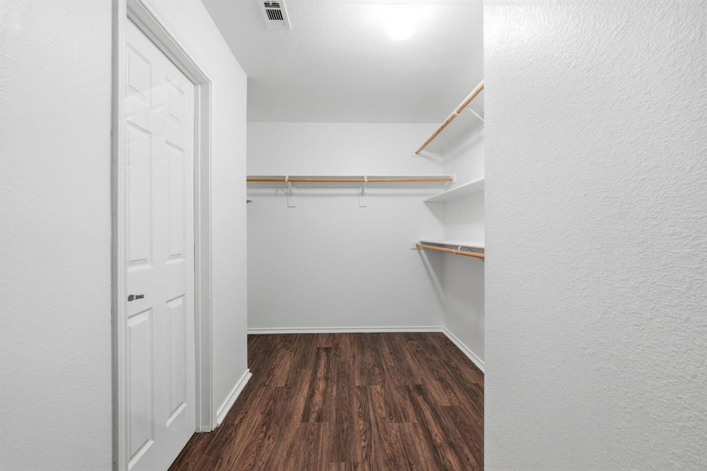 111 Maned Drive Sanger, TX 76266 - Photo 28 of 40 a view of walk in closet with wooden floor