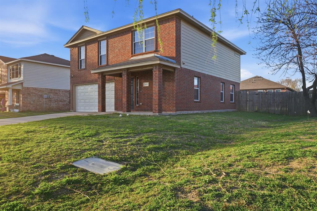 111 Maned Drive Sanger, TX 76266 - Photo 3 of 40 a view of a house with a yard