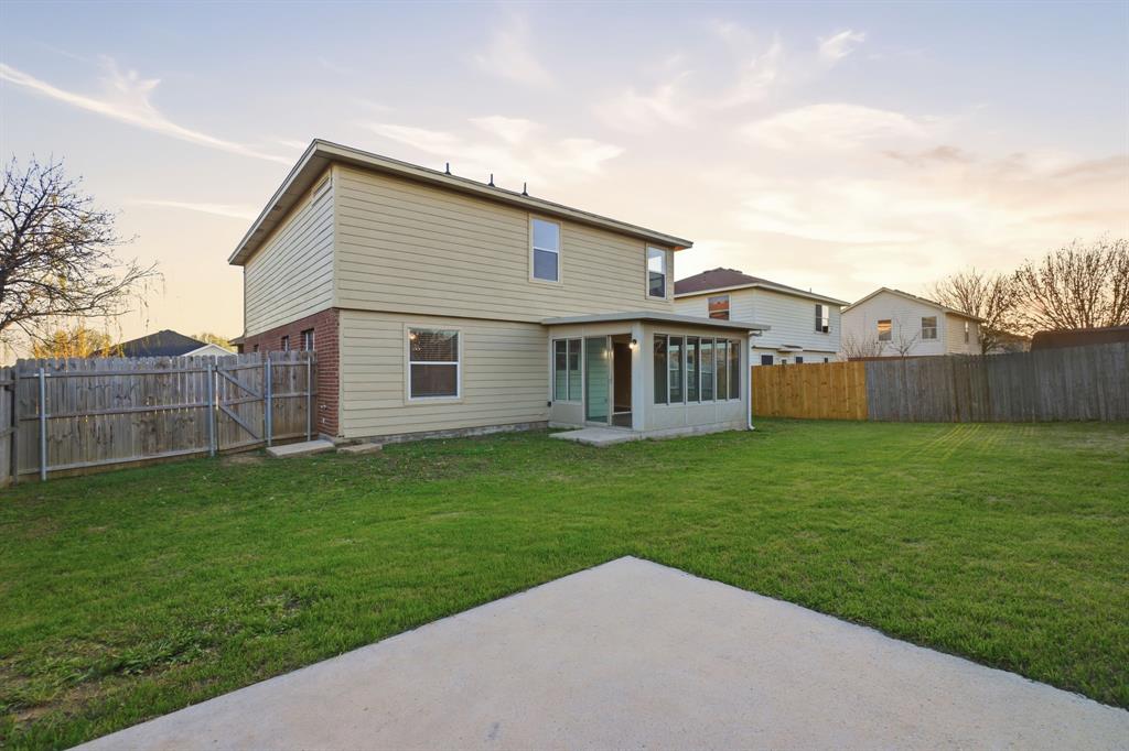 111 Maned Drive Sanger, TX 76266 - Photo 35 of 40 a view of a backyard with plants and wooden fence