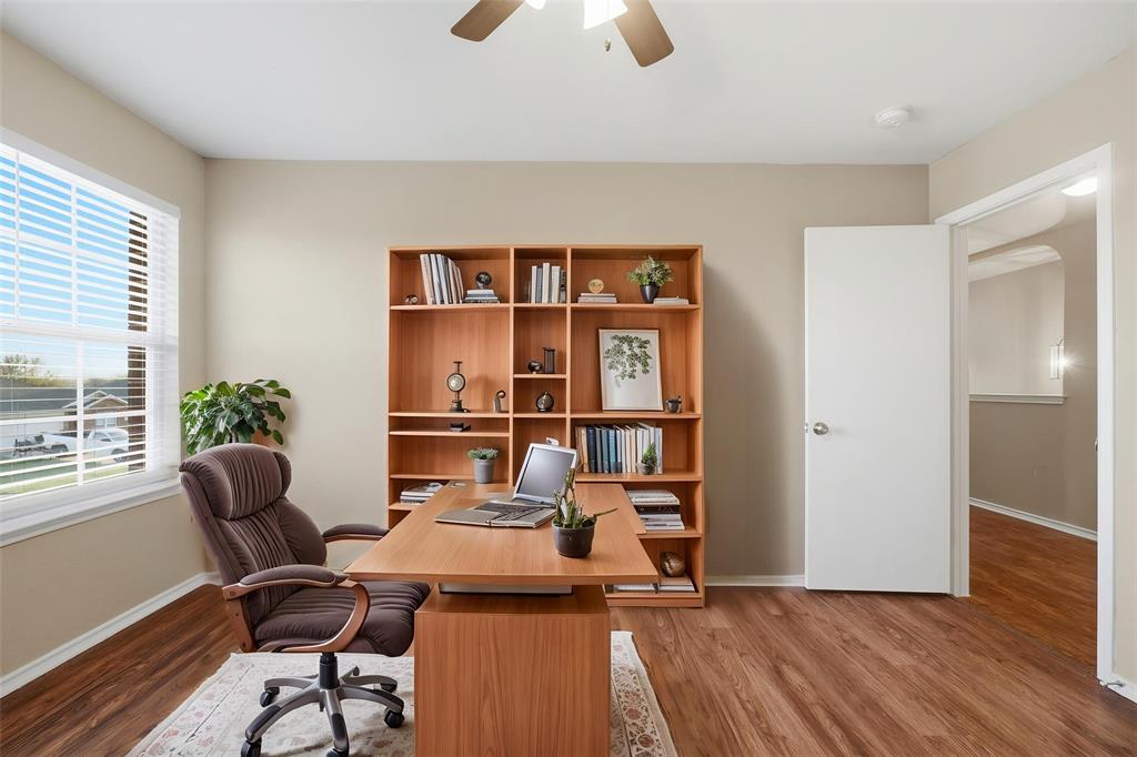 111 Maned Drive Sanger, TX 76266 - Photo 6 of 40 a work room with furniture and a book shelf